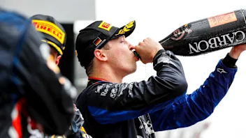 HOCKENHEIMRING, GERMANY - JULY 28: Daniil Kvyat, Toro Rosso, 3rd position, drinks Champagne on the