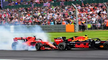 SILVERSTONE, UNITED KINGDOM - JULY 14: Sebastian Vettel, Ferrari SF90 running into the back of Max
