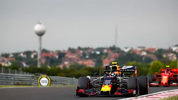 HUNGARORING, HUNGARY - AUGUST 02: Pierre Gasly, Red Bull Racing RB15, leads Charles Leclerc,