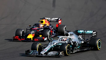 HUNGARORING, HUNGARY - AUGUST 04: Lewis Hamilton, Mercedes AMG F1 W10 overtakes Max Verstappen, Red