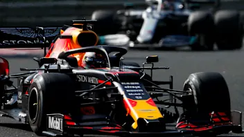 HUNGARORING, HUNGARY - AUGUST 04: Max Verstappen, Red Bull Racing RB15, leads Lewis Hamilton,