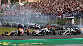 HUNGARORING, HUNGARY - AUGUST 04: Max Verstappen, Red Bull Racing RB15, leads Lewis Hamilton,