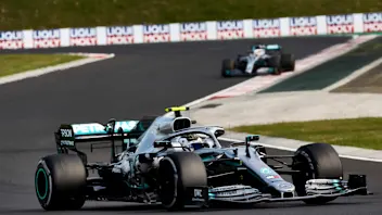 HUNGARORING, HUNGARY - AUGUST 04: Valtteri Bottas, Mercedes AMG W10, leads Lewis Hamilton, Mercedes