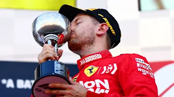 SUZUKA, JAPAN - OCTOBER 13: Second placed Sebastian Vettel of Germany and Ferrari celebrates on the