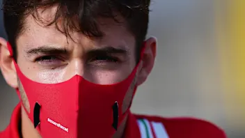 NORTHAMPTON, ENGLAND - AUGUST 06: Charles Leclerc of Monaco and Ferrari looks on in the Paddock