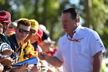 MELBOURNE, AUSTRALIA - MARCH 12: McLaren Chief Executive Officer Zak Brown sings autographs as he