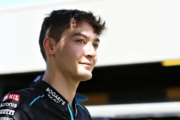 MELBOURNE, AUSTRALIA - MARCH 12: George Russell of Great Britain and Williams walks in the Paddock
