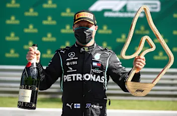 SPIELBERG, AUSTRIA - JULY 05: Race winner Valtteri Bottas of Finland and Mercedes GP poses with the
