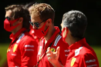 SPIELBERG, AUSTRIA - JULY 02: Sebastian Vettel of Germany and Ferrari walks the track with