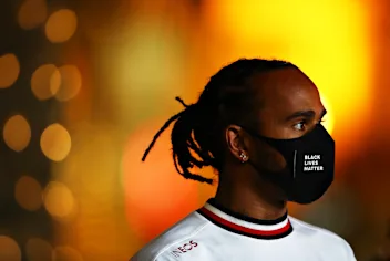 BAHRAIN, BAHRAIN - NOVEMBER 26: Lewis Hamilton of Great Britain and Mercedes GP talks to the media