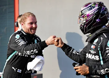IMOLA, ITALY - OCTOBER 31: Pole position qualifier Valtteri Bottas of Finland and Mercedes GP bumps