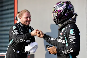 IMOLA, ITALY - OCTOBER 31: Pole position qualifier Valtteri Bottas of Finland and Mercedes GP bumps