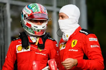 IMOLA, ITALY - NOVEMBER 01: Charles Leclerc of Monaco and Ferrari speaks with teammate Sebastian