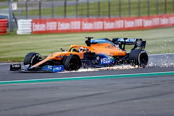 NORTHAMPTON, ENGLAND - AUGUST 02: Carlos Sainz of Spain driving the (55) McLaren F1 Team MCL35