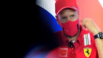 NORTHAMPTON, ENGLAND - JULY 30: Sebastian Vettel of Germany and Ferrari talks in the Drivers Press