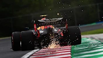 BUDAPEST, HUNGARY - JULY 17: Sparks fly behind Alexander Albon of Thailand driving the (23) Aston