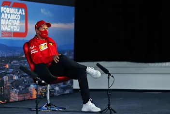 BUDAPEST, HUNGARY - JULY 16: Sebastian Vettel of Germany and Ferrari talks in the Drivers Press