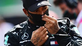 MONZA, ITALY - SEPTEMBER 06: Lewis Hamilton of Great Britain and Mercedes GP looks on during the F1