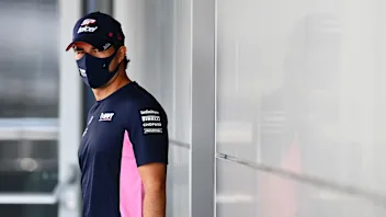 SOCHI, RUSSIA - SEPTEMBER 24: Sergio Perez of Mexico and Racing Point walks in the Paddock during