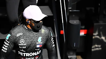 BARCELONA, SPAIN - AUGUST 14: Lewis Hamilton of Great Britain and Mercedes GP walks to the garage