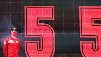 ISTANBUL, TURKEY - NOVEMBER 15: Third placed Sebastian Vettel of Germany and Ferrari stands on the