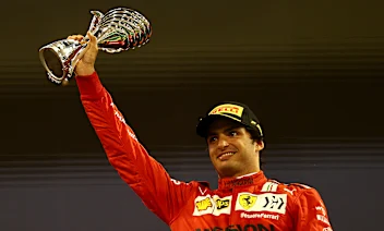 ABU DHABI, UNITED ARAB EMIRATES - DECEMBER 12: Third placed Carlos Sainz of Spain and Ferrari