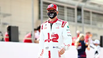 BAHRAIN, BAHRAIN - MARCH 12: Kimi Raikkonen of Finland and Alfa Romeo Racing looks on from the grid