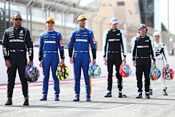BAHRAIN, BAHRAIN - MARCH 12:  Lando Norris of Great Britain and McLaren F1 stands with team mate