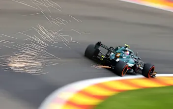 SPA, BELGIUM - AUGUST 27: Sparks fly behind Sebastian Vettel of Germany driving the (5) Aston