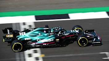 NORTHAMPTON, ENGLAND - JULY 16: Lance Stroll of Canada driving the (18) Aston Martin AMR21 Mercedes