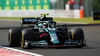 BUDAPEST, HUNGARY - AUGUST 01: Sebastian Vettel of Germany driving the (5) Aston Martin AMR21