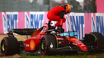 IMOLA, ITALY - APRIL 22: Carlos Sainz of Spain and Ferrari climbs from his car after crashing