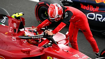 NORTHAMPTON, ENGLAND - JULY 03: Race winner Carlos Sainz of Spain and Ferrari is congratulated by