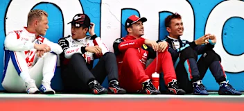 BUDAPEST, HUNGARY - JULY 31: (L-R) Kevin Magnussen of Denmark and Haas F1, Zhou Guanyu of China and