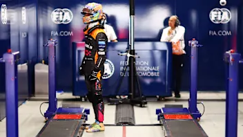 SUZUKA, JAPAN - OCTOBER 08: Eleventh placed qualifier Daniel Ricciardo of Australia and McLaren