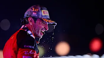 SINGAPORE, SINGAPORE - SEPTEMBER 17: Race winner Carlos Sainz of Spain and Ferrari celebrates on