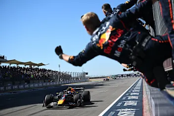 AUSTIN, TEXAS - OCTOBER 19: The Oracle Red Bull Racing team cheer as Race winner Max Verstappen of