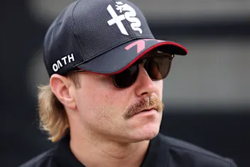 NORTHAMPTON, ENGLAND - JULY 06: Valtteri Bottas of Finland and Alfa Romeo F1 walks in the Paddock