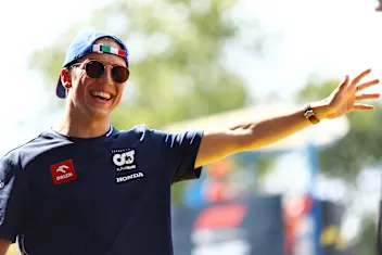 MONZA, ITALY - SEPTEMBER 03: Liam Lawson of New Zealand and Scuderia AlphaTauri waves to the crowd