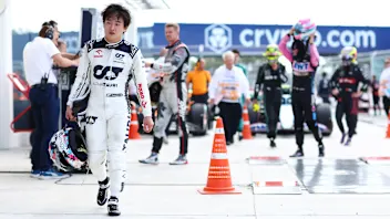 MIAMI, FLORIDA - MAY 07: Yuki Tsunoda of Japan and Scuderia AlphaTauri looks on in parc ferme