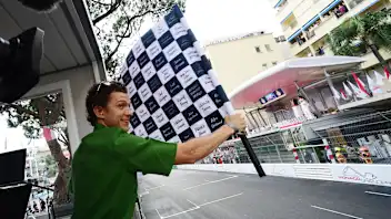 MONTE-CARLO, MONACO - MAY 28: Tom Holland waves the chequered flag during the F1 Grand Prix of