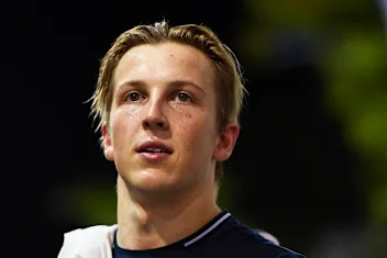 SINGAPORE, SINGAPORE - SEPTEMBER 17: Liam Lawson of New Zealand and Scuderia AlphaTauri looks on in