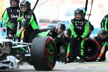 SUZUKA, JAPAN - APRIL 05: The Stake F1 Team Kick Sauber pit crew conduct a pit stop during