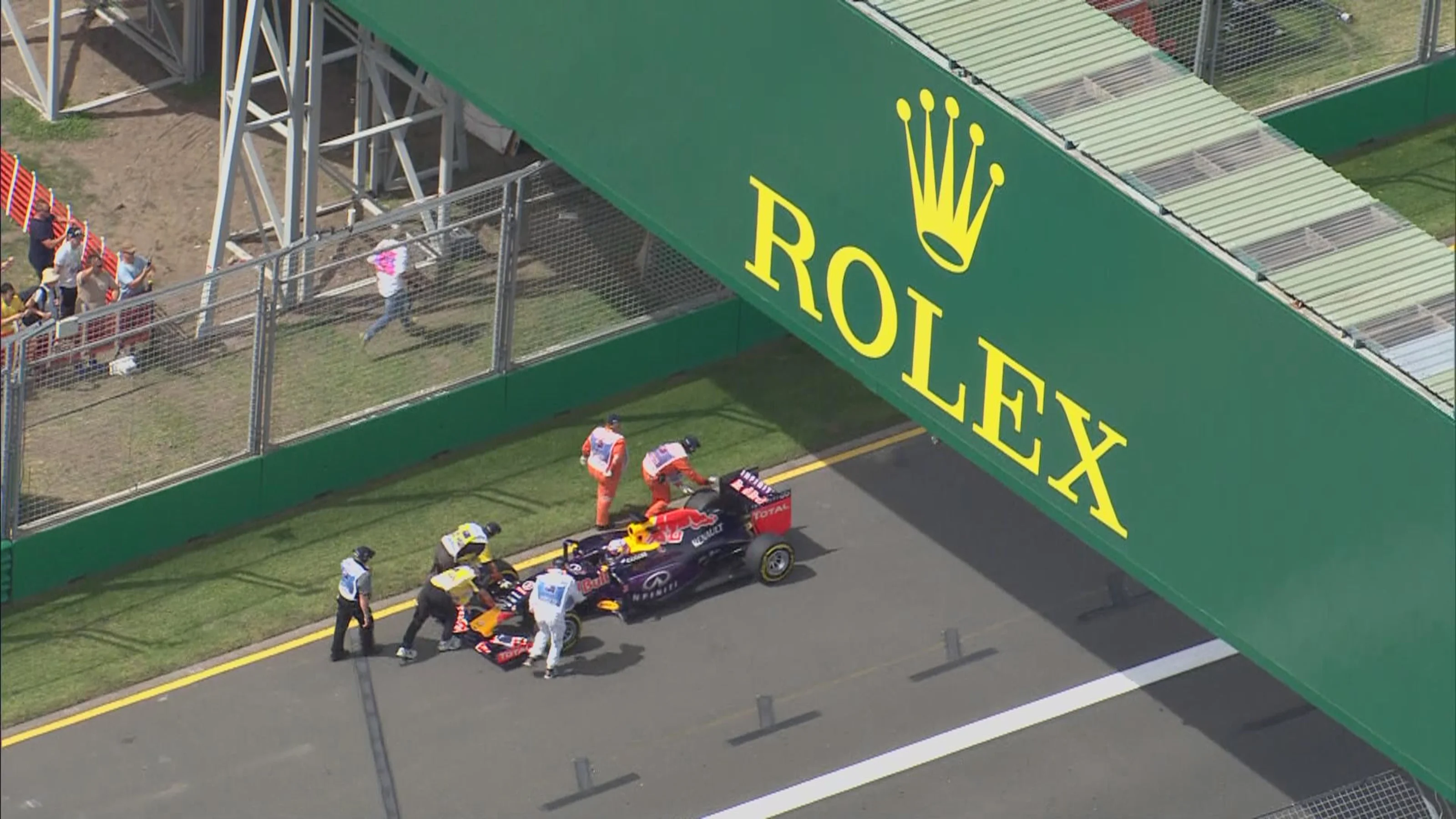 Red Bull's Daniel Ricciardo is pushed to safety after losing power
