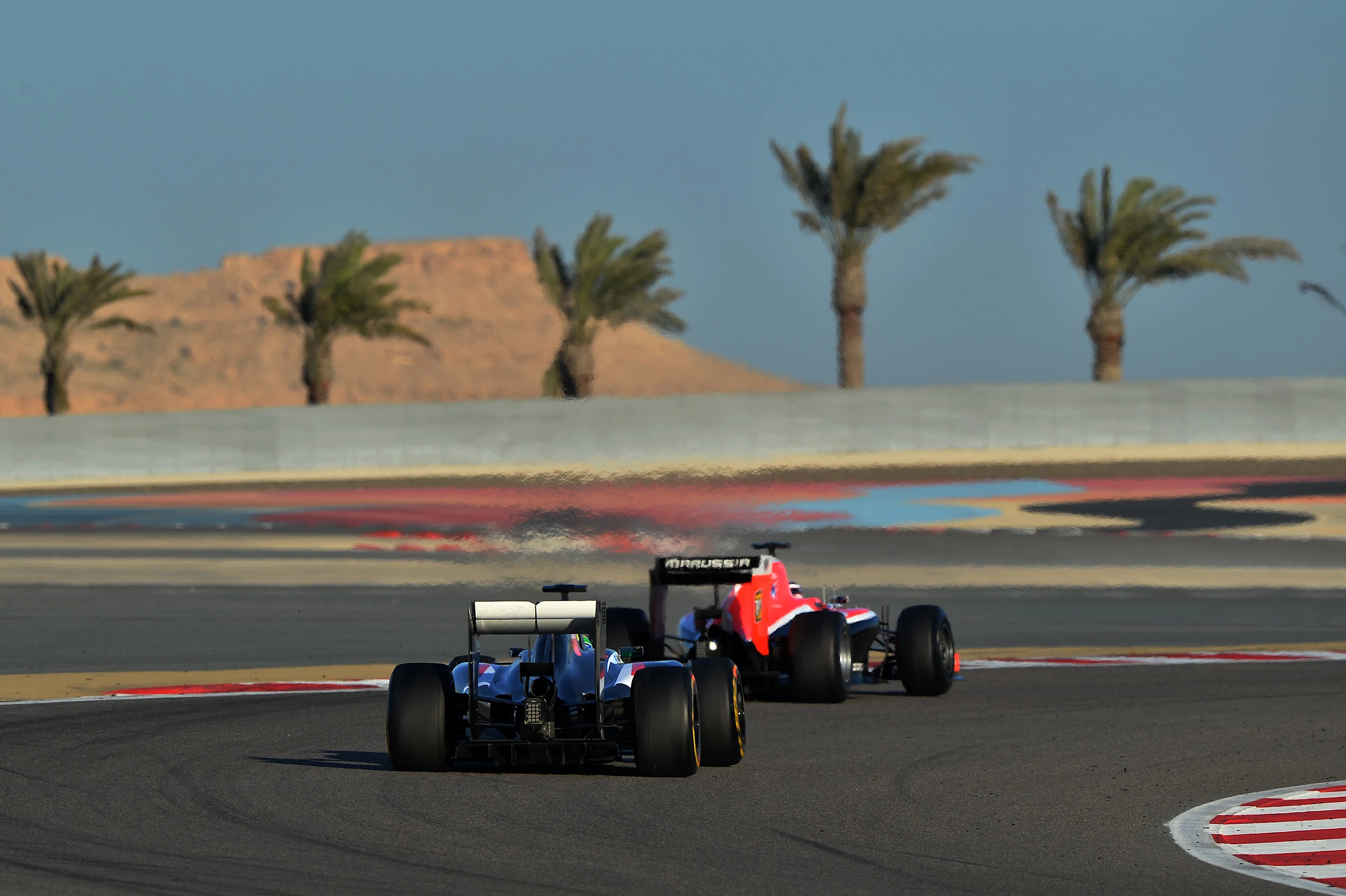 Esteban Gutierrez (MEX) Sauber C33 and Max Chilton (GBR) Marussia F1 Team MR03. Formula One