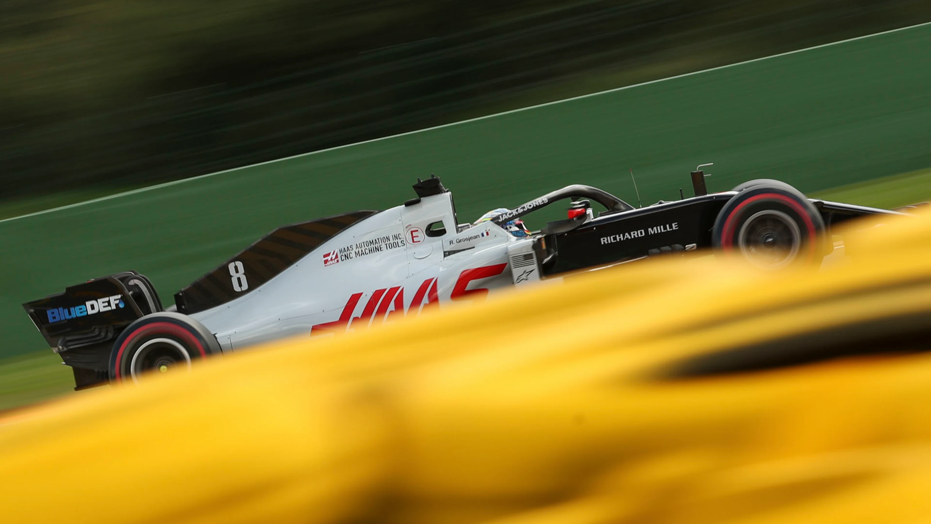 Haas driver Romain Grosjean of France steers his car during a practice session for the Formula One