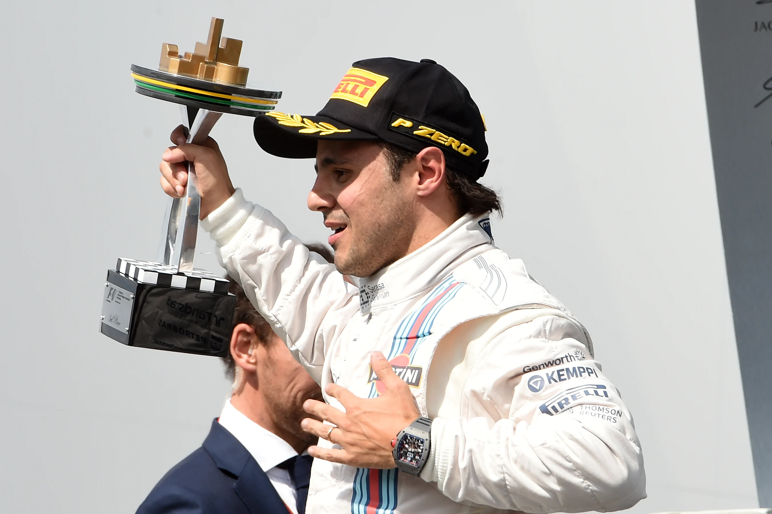 Felipe Massa (BRA) Williams celebrates on the podium with the trophy. Formula One World