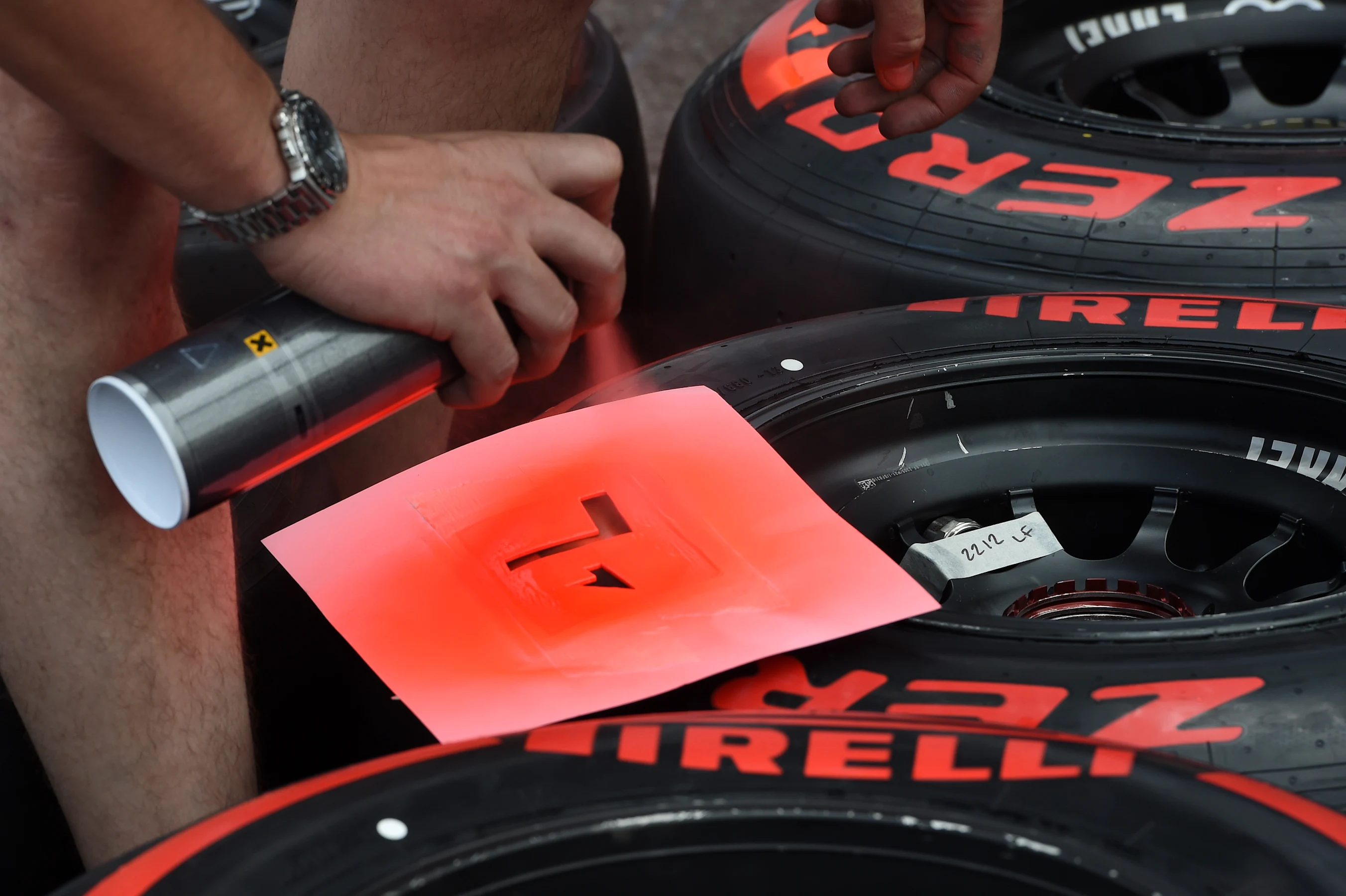 Pirelli tyres are sprayed with a stencil. Formula One World Championship, Rd6, Monaco Grand Prix,