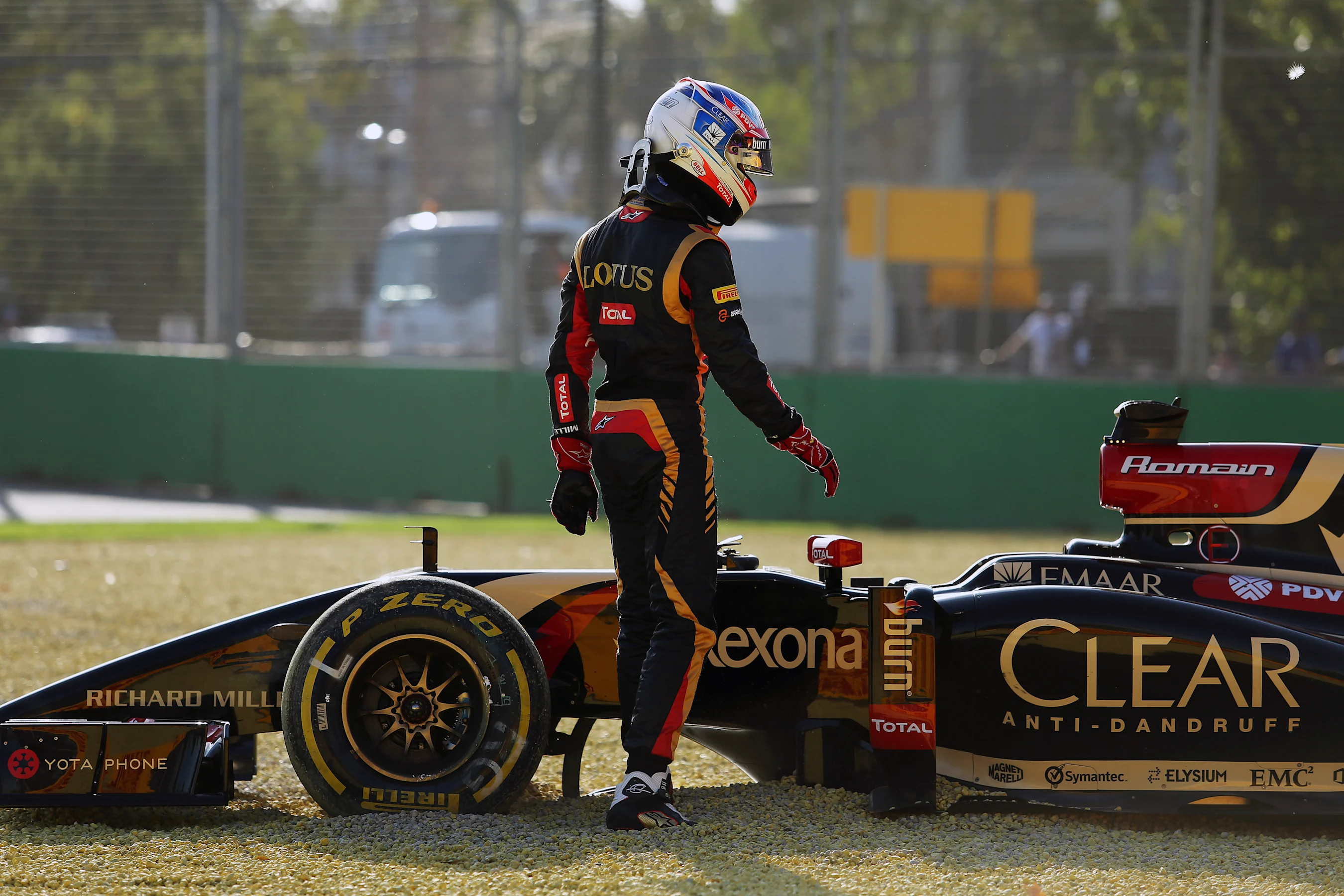 Romain Grosjean (FRA) Lotus E22 spins into the gravel. Formula One World Championship, Rd1,