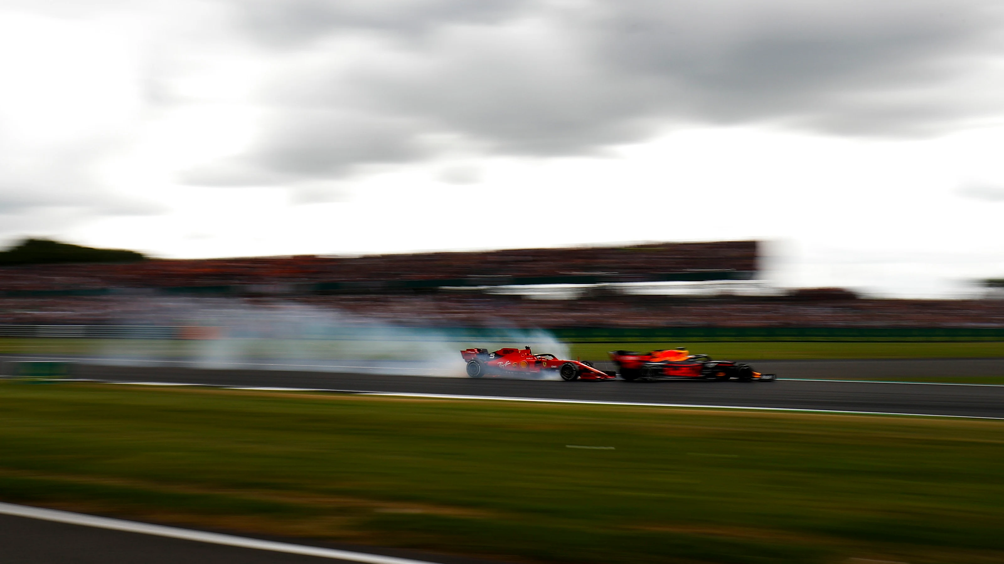 SILVERSTONE, UNITED KINGDOM - JULY 14: Sebastian Vettel, Ferrari locks up and runs into the back of